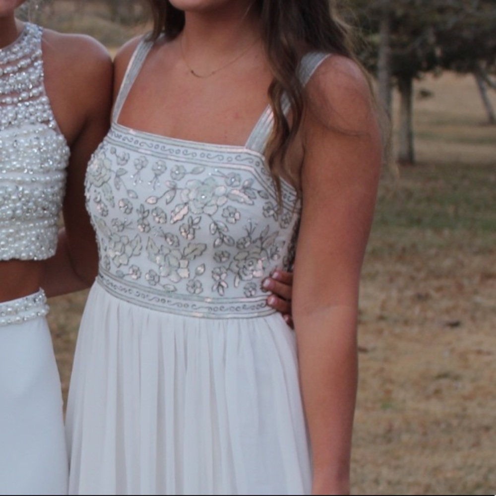 beautiful white dress with silver detailing